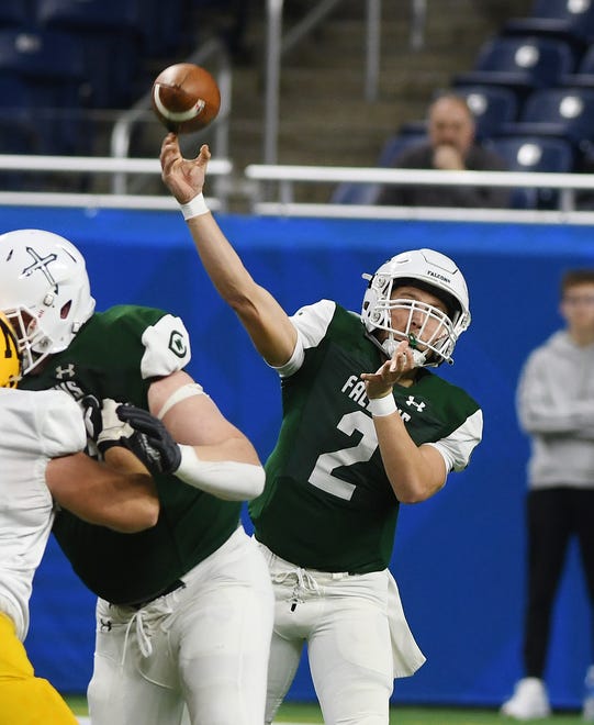 On the first offensive play of the game, West Catholic quarterback Bernie Vamesdeel throws a pass to teammate Carter Perry, who runs it down the field for a touchdown in the first half.