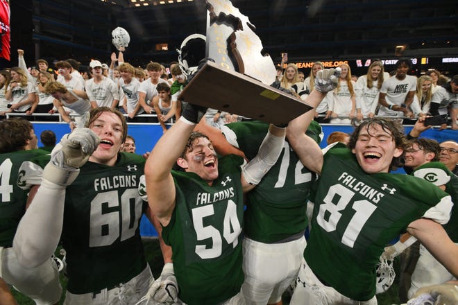 Grand Rapids West Catholic celebrates its Division 6 state championship after beating Negaunee.