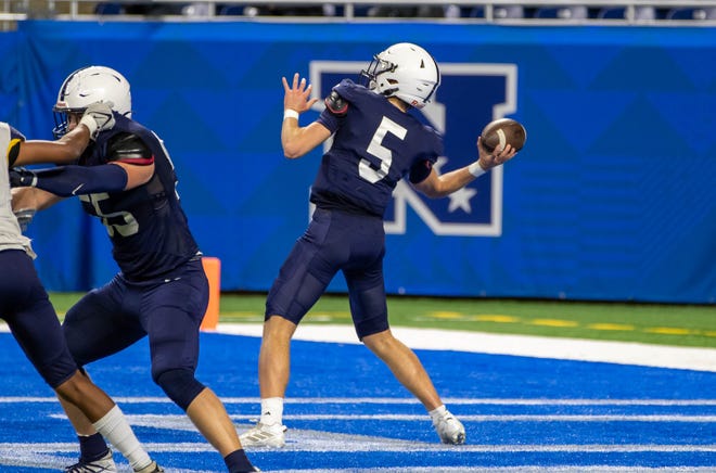 Grand Rapids South Christian quarterback Jacob DeHaan (5) launches a pass from the end zone during the second quarter.