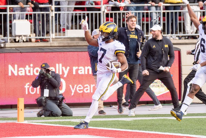 Michigan running back Donovan Edwards celebrates as he crossed into the end zone for a touchdown during the fourth quarter.