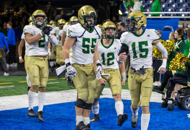 Jackson Lumen Christi players take the field before the Division 7 state final against Traverse City St. Francis.