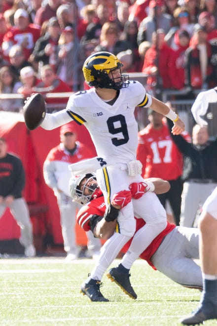 Michigan quarterback J.J. McCarthy received an intentional grounding penalty on this play while being tackled by Ohio State linebacker Cody Simon during the first quarter.
