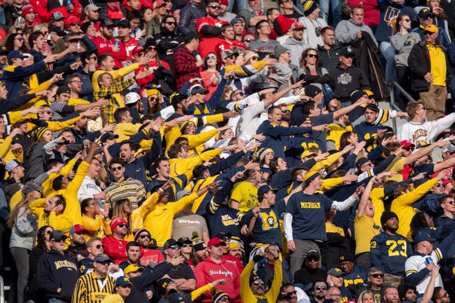 Michigan fans cheer together during the fourth quarter.