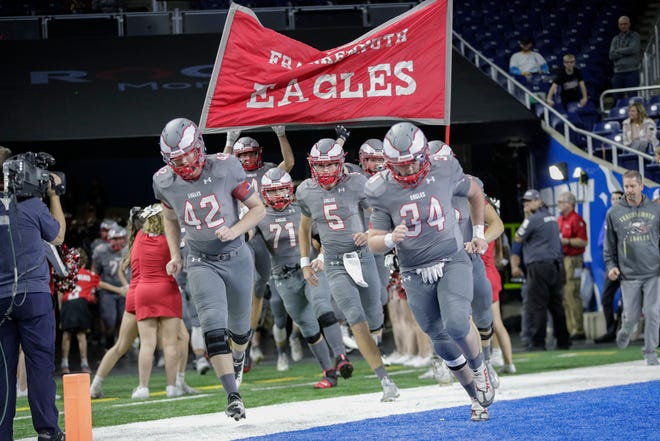 Frankenmuth high players take the field prior to the start of the Division 5 state final.