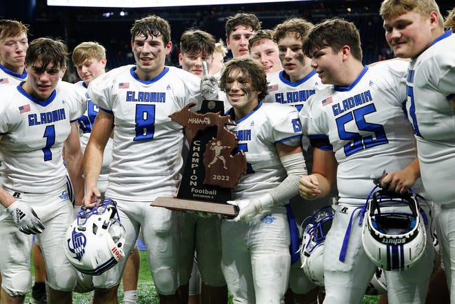 Gladwin players pose for a photo at the conclusion of the Division 5 state final.
