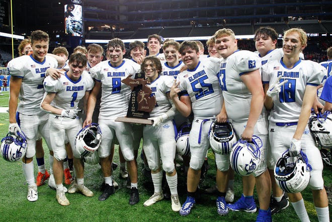 Gladwin players pose for a photo at the conclusion of the Division 5 state final.