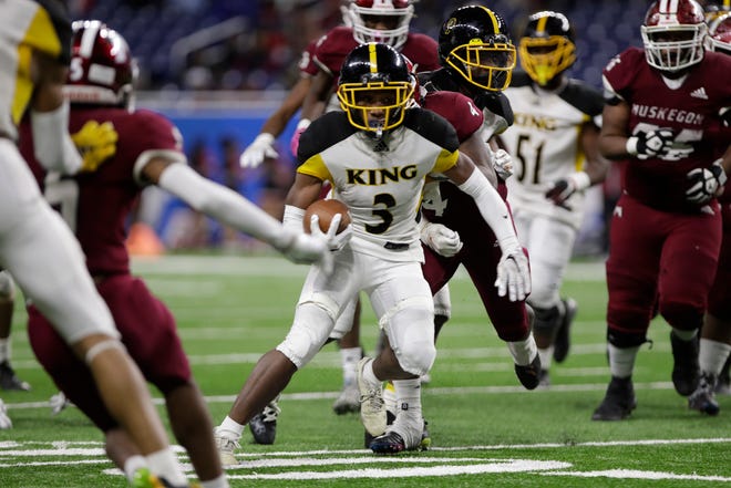 Detroit Martin Luther King senior running back Sterling Anderson Jr. runs the ball during the second half of the division 3 championship game against Muskegeon Saturday at Ford Field.