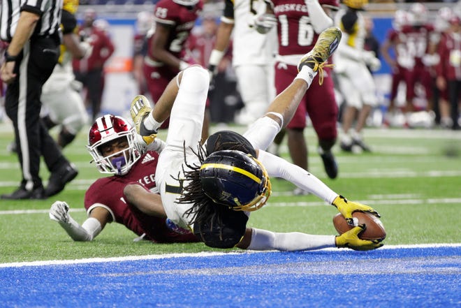 Detroit Martin Luther King senior defensive back Jameel Croft Jr. (7) dives for a touchdown during the second half of the division 3 championship game against Muskegeon Saturday at Ford Field.