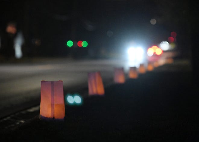 Luminaries line Glaspie Road in Oxford, Mich. on Nov. 30, 2022.  Luminaries are lit and on display in Oxford in memory of the four students killed one year ago at Oxford High School.