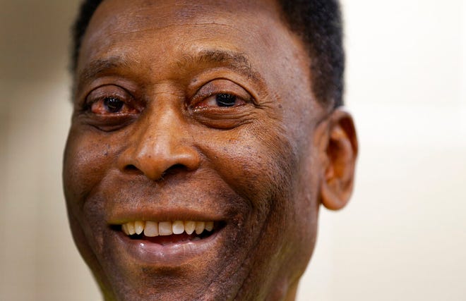 In this March 20, 2015 file photo, Brazilian soccer legend Pele smiles during a media opportunity at a restaurant in London.