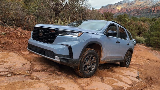 With its tough underbelly and lifted suspension, the 2023 Honda Pilot TrailSport scrambles up rock steps on Broken Arrow Trail, Sedona.