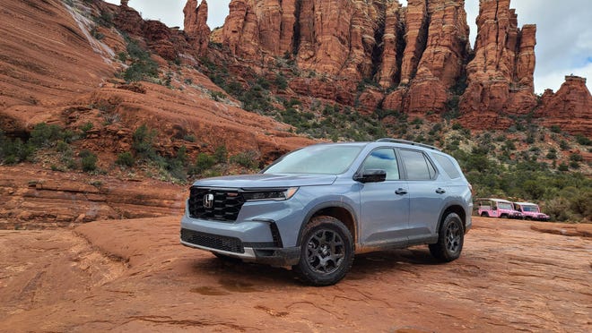 All-new for 2023, the Honda Pilot TrailSport comes equipped with skid plates, all-terrain tires and a lifted chassis for better off-road capability.