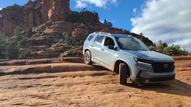 The 2023 Honda Pilot TrailSport's all-terrain tires make for eas descent down the slippery rock stairs of Broken Arrow Trail, Sedona.
