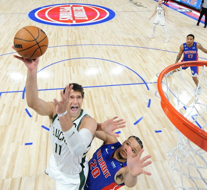 Milwaukee Bucks center Brook Lopez (11) scores over Detroit Pistons forward Kevin Knox II (20) in the fourth quarter.