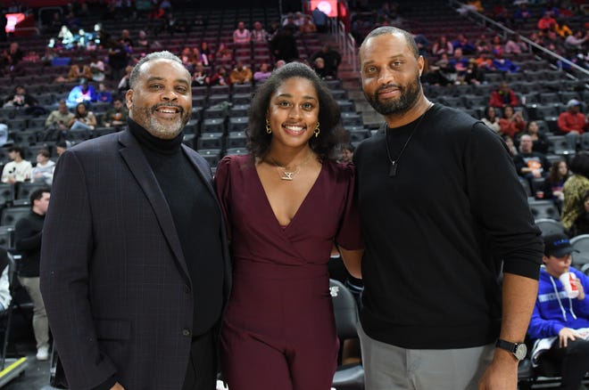 L-r, Walter Lanier, (son), Alexis Silver, (granddaughter) and Robert Lanier Jr. (son), poses for a photo after the ceremony to honor Pistons great Bob Lanier.