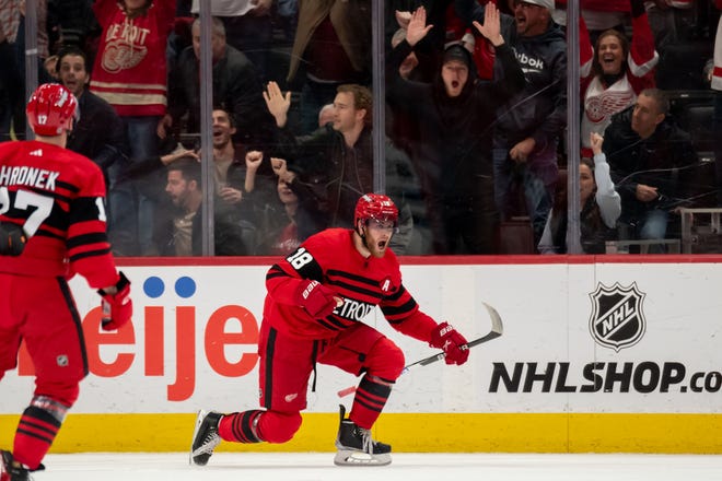 Detroit center Andrew Copp celebrates after scoring the game winning goal during the overtime period of a game between the Detroit Red Wings and the San Jose Sharks at Little Caesars Arena, in Detroit, January 24, 2023.