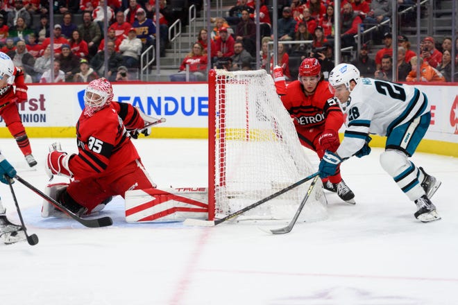 San Jose right wing Timo Meier slips the puck behind Detroit goaltender Ville Husso for a goal during the second period of a game between the Detroit Red Wings and the San Jose Sharks at Little Caesars Arena, in Detroit, January 24, 2023.