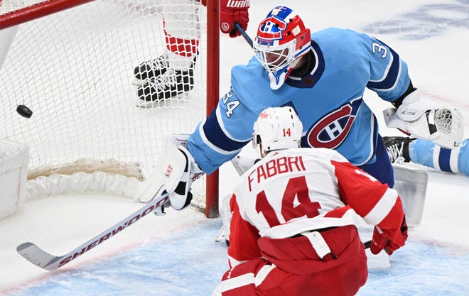 Detroit Red Wings' Robby Fabbri (14) scores against Montreal Canadiens goaltender Jake Allen (34) during overtime.