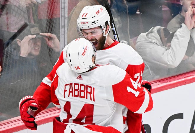 Detroit Red Wings' Robby Fabbri (14) celebrates with teammate Michael Rasmussen after scoring against the Montreal Canadiens in overtime.