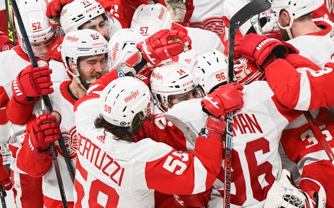 Detroit Red Wings' Robby Fabbri (14) celebrates with teammates after scoring against the Montreal Canadiens in overtime.
