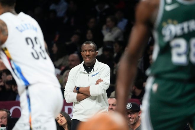 Detroit Pistons coach Dwane Casey watches during the first half.