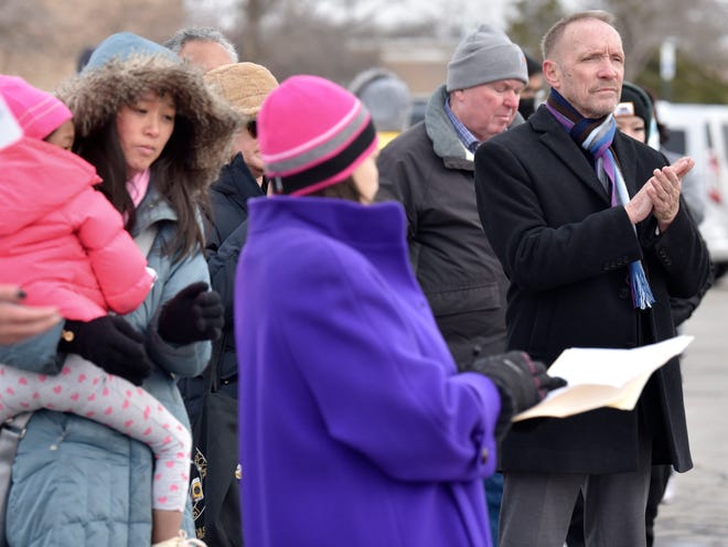 Michigan Sen. Stephanie Chang, left, Madison Heights Mayor Roslyn Grafstein, center, and Oakland County Executive David Coulter, right, spoke at the vigil.