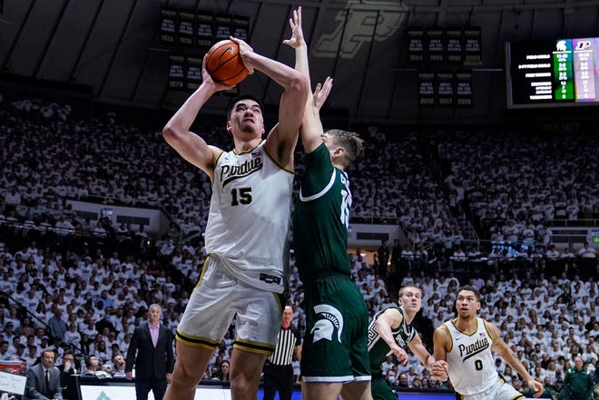 Purdue center Zach Edey (15) shoots over Michigan State center Carson Cooper (15) during the second half.