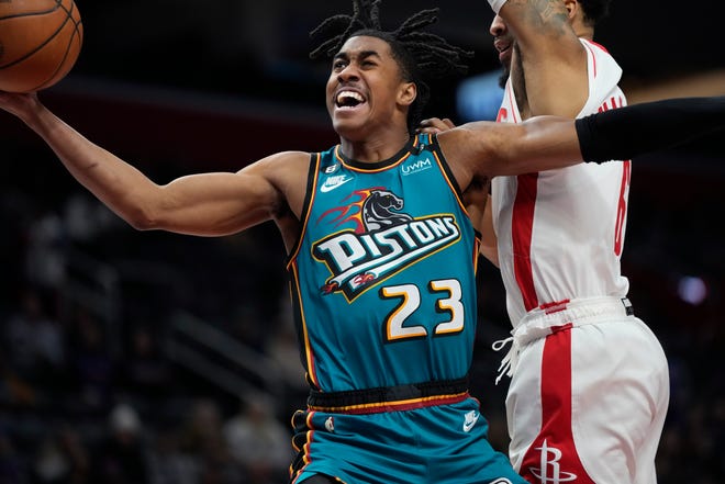 Detroit Pistons guard Jaden Ivey (23) attempts a layup as Houston Rockets forward Kenyon Martin Jr. defends during the first half of an NBA basketball game, Saturday, Jan. 28, 2023, in Detroit.