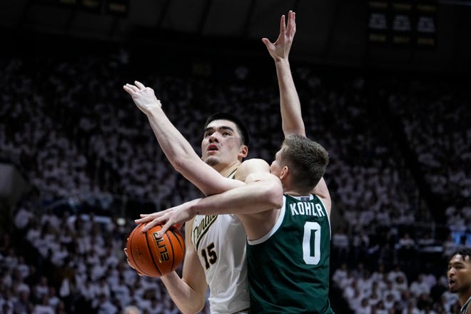 Purdue center Zach Edey (15) is fouled by Michigan State forward Jaxon Kohler (0) as he shoots during the second half.