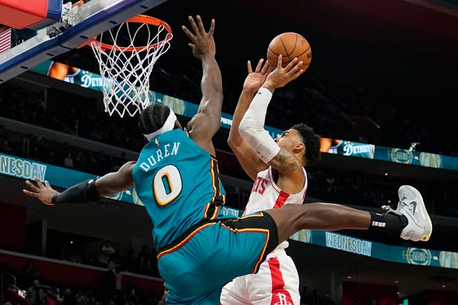 Houston Rockets forward Kenyon Martin Jr. is fouled by Detroit Pistons center Jalen Duren (0) during the second half.