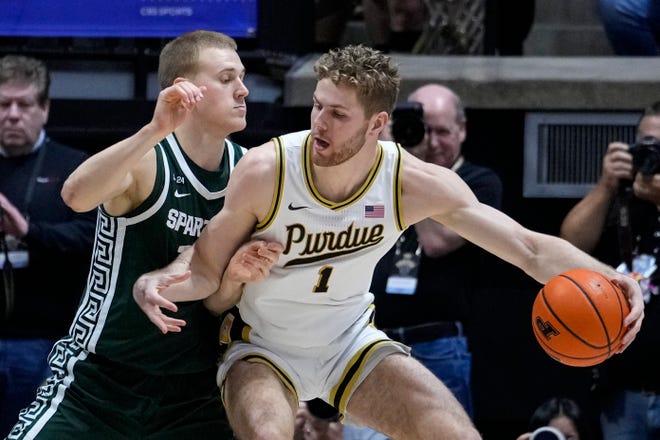 Purdue forward Caleb Furst (1) drives on Michigan State forward Joey Hauser (10) during the first half.