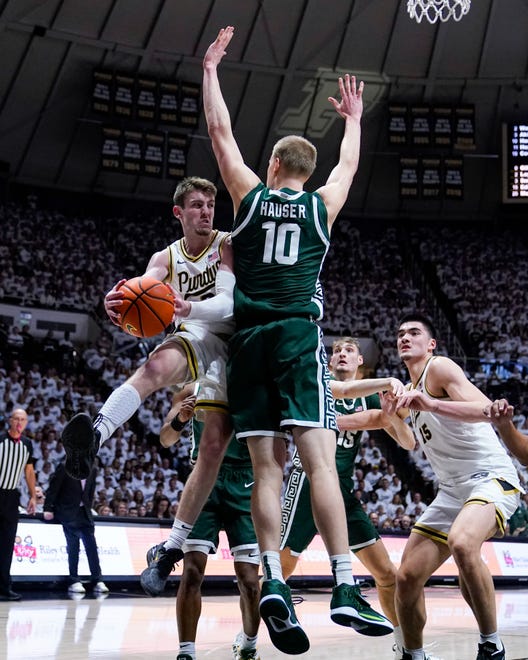 Purdue guard Braden Smith (3) makes a pass around Michigan State forward Joey Hauser (10) during the second half.
