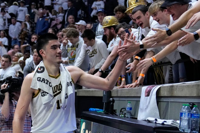Purdue center Zach Edey (15) greets fans as he leaves the floor following an NCAA college basketball game against Michigan State in West Lafayette, Ind., Sunday, Jan. 29, 2023. Purdue defeated Michigan State, 77-61.