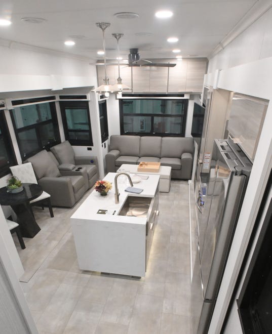 The living room and kitchen area of the amazing Riverstone 41RL, on sale for $199,990 and yes, it really is an RV.