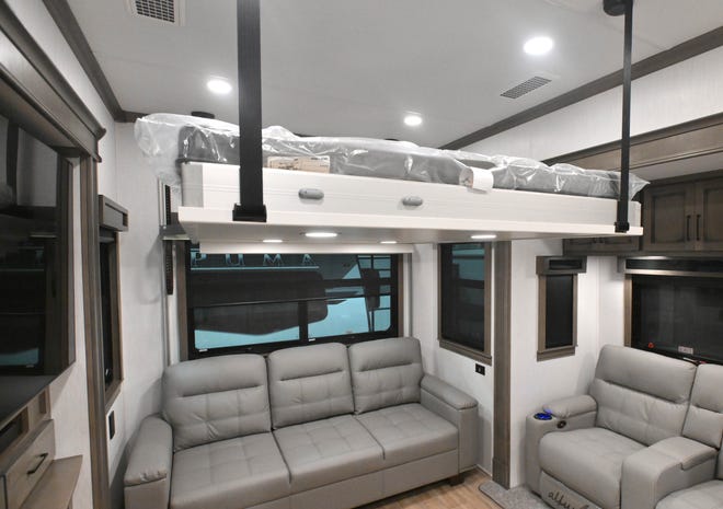 The Riverstone 442MC complete with a bed that raises to the ceiling and lowers to the floor to achieve even greater space in the massive RV.