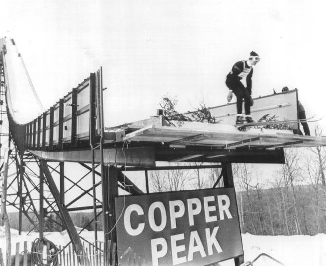Tom Dennison, of the U.S. ski team is the first official flyer of the competition held in 1970, as he took off from the end of Copper Peak ski slide in the First International Ski Flying Meet. The meet dedicated the hill which has the world's largest artificial slide, equivalent to the height of a 24-story building. Dennison was allowed to jump again when it was decided to move the competitors up one chute for longer distances.