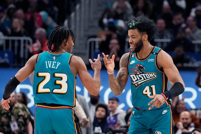 Detroit Pistons forward Saddiq Bey (41) celebrates a three-point basket with teammate guard Jaden Ivey (23) during the second half of an NBA basketball game against the Charlotte Hornets, Friday, Feb. 3, 2023, in Detroit.