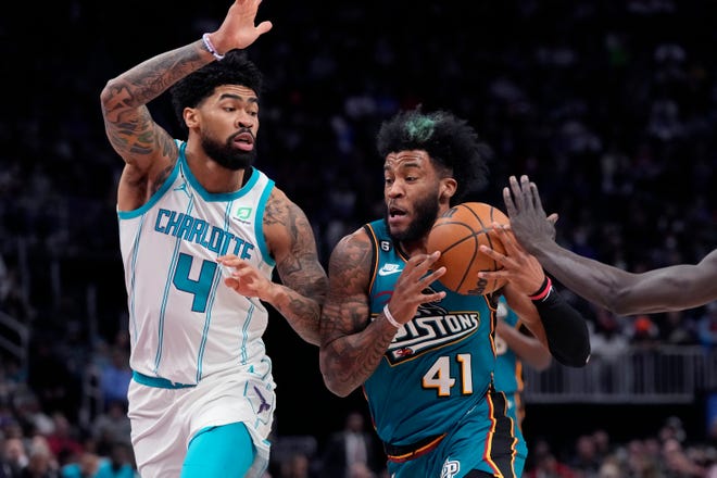Detroit Pistons forward Saddiq Bey (41) drives as Charlotte Hornets center Nick Richards (4) defends during the first half of an NBA basketball game, Friday, Feb. 3, 2023, in Detroit.