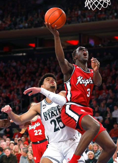 Rutgers forward Mawot Mag (3) drives to the basket against Michigan State forward Malik Hall (25) during the first half of an NCAA college basketball game in New York, Saturday, Feb. 4, 2023. Rutgers won the game, 61-55.