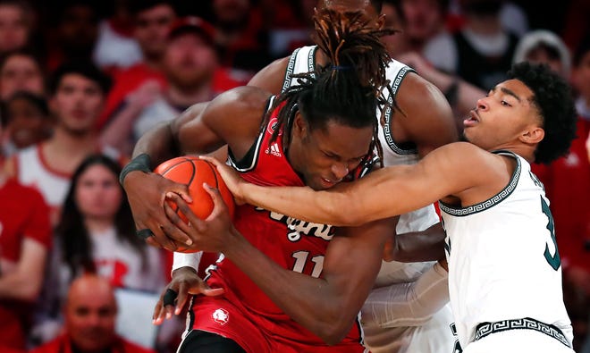 Michigan State guard Jaden Akins (3) fouls Rutgers center Clifford Omoruyi (11) battling for the ball during the second half.