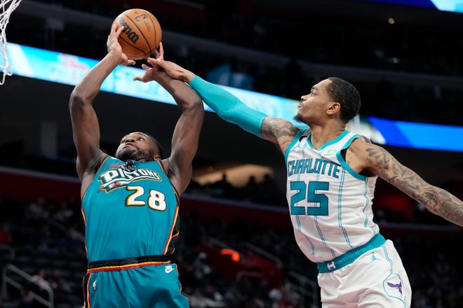 Detroit Pistons center Isaiah Stewart (28) is fouled by Charlotte Hornets forward P.J. Washington (25) during the first half of an NBA basketball game, Friday, Feb. 3, 2023, in Detroit.