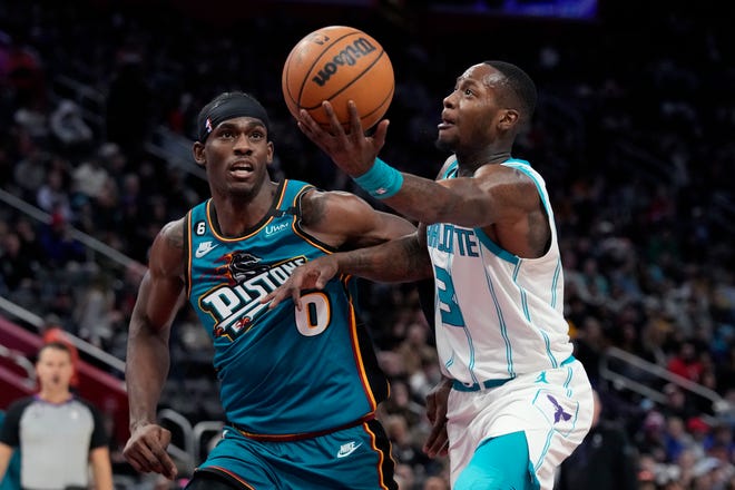 Charlotte Hornets guard Terry Rozier (3) attempts a layup as Detroit Pistons center Jalen Duren (0) defends during the second half of an NBA basketball game, Friday, Feb. 3, 2023, in Detroit.