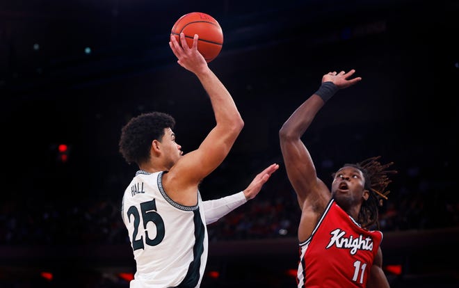 Michigan State forward Malik Hall (25) shoots over Rutgers center Clifford Omoruyi (11) during the second half.