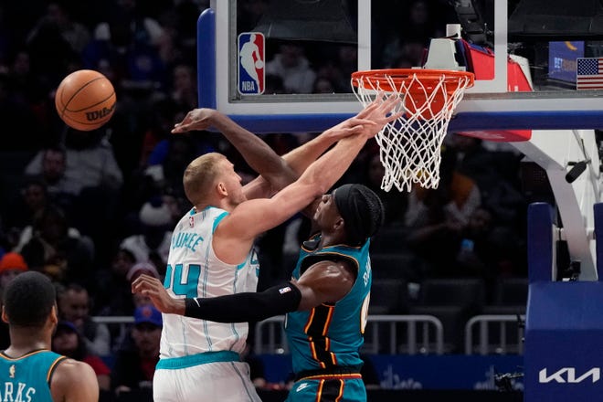 Detroit Pistons center Jalen Duren (0) blocks a shot by Charlotte Hornets center Mason Plumlee (24) during the first half of an NBA basketball game, Friday, Feb. 3, 2023, in Detroit.