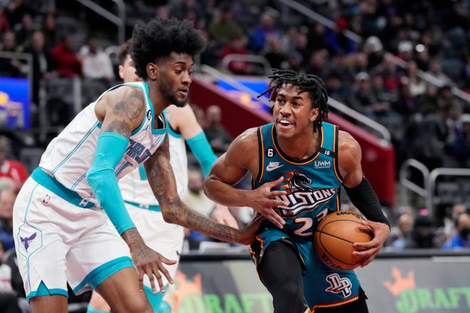 Detroit Pistons guard Jaden Ivey (23) drives as Charlotte Hornets forward Jalen McDaniels (6) defends during the first half of an NBA basketball game, Friday, Feb. 3, 2023, in Detroit.