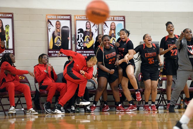 The Detroit Edison girls basketball bench celebrates after NaBrea Lane made the second of her two free throws against Farmington Hills Mercy near the end of the fourth quarter, Friday, Feb. 3, 2023, at Mercy HS in Farmington Hills, Mich. Edison defeated Mercy 44-42.