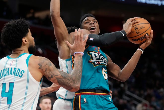 Detroit Pistons guard Hamidou Diallo (6) is defended by Charlotte Hornets center Nick Richards (4) during the first half of an NBA basketball game, Friday, Feb. 3, 2023, in Detroit.