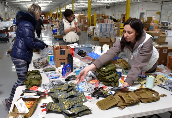 Volunteers pack individual-first-aid-kits, Saturday afternoon, April 16, 2022.

XXXX Oleksadr ÔSashaÕ Tkachenko, originally of Ukraine, and other members of a local group of Ukrainian patriotic volunteers assemble individual-first-aid-kits (IFAK) and field-medicsÕ kits at a warehouse on the Detroit - Hamtramck border, Saturday afternoon, April 16, 2022. The kits are then be flown internationally to be distributed to front-line Ukrainian soldiers. The volunteers were trained and instructed by former US military combat medics on proper assembly instructions and contents. (Todd McInturf, The Detroit News)2022.