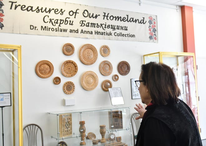Executive director Olga Liskiwskyi talks about the installation Treasures of our Homeland at the Ukrainian American Archives and Museum in Hamtramck, Mich. on Mar. 29, 2022.  
(Robin Buckson / The Detroit News)